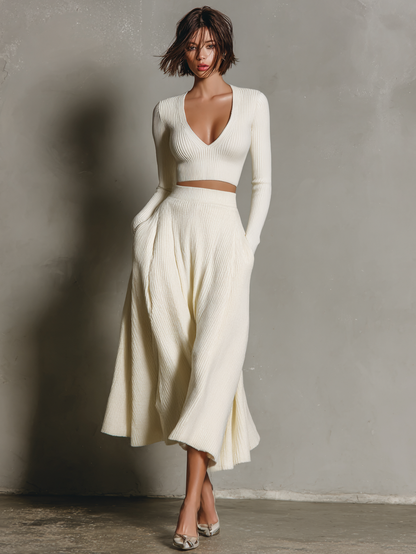 Conjunto de suéter corto y falda de punto de color sólido para mujer con cuello en V MDA2156J3Y